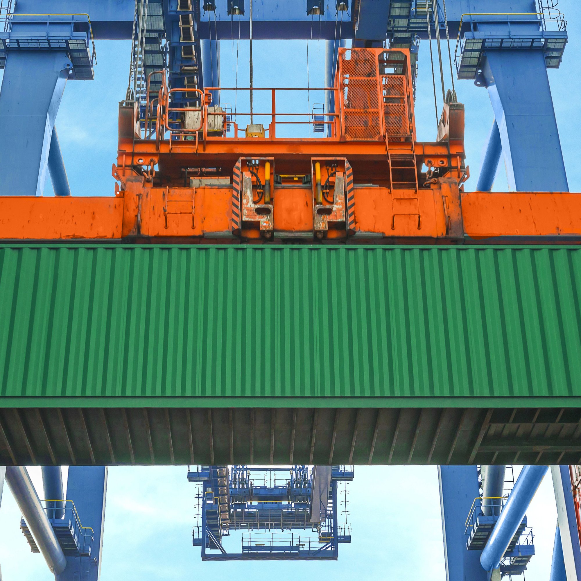 Shore crane loading container.