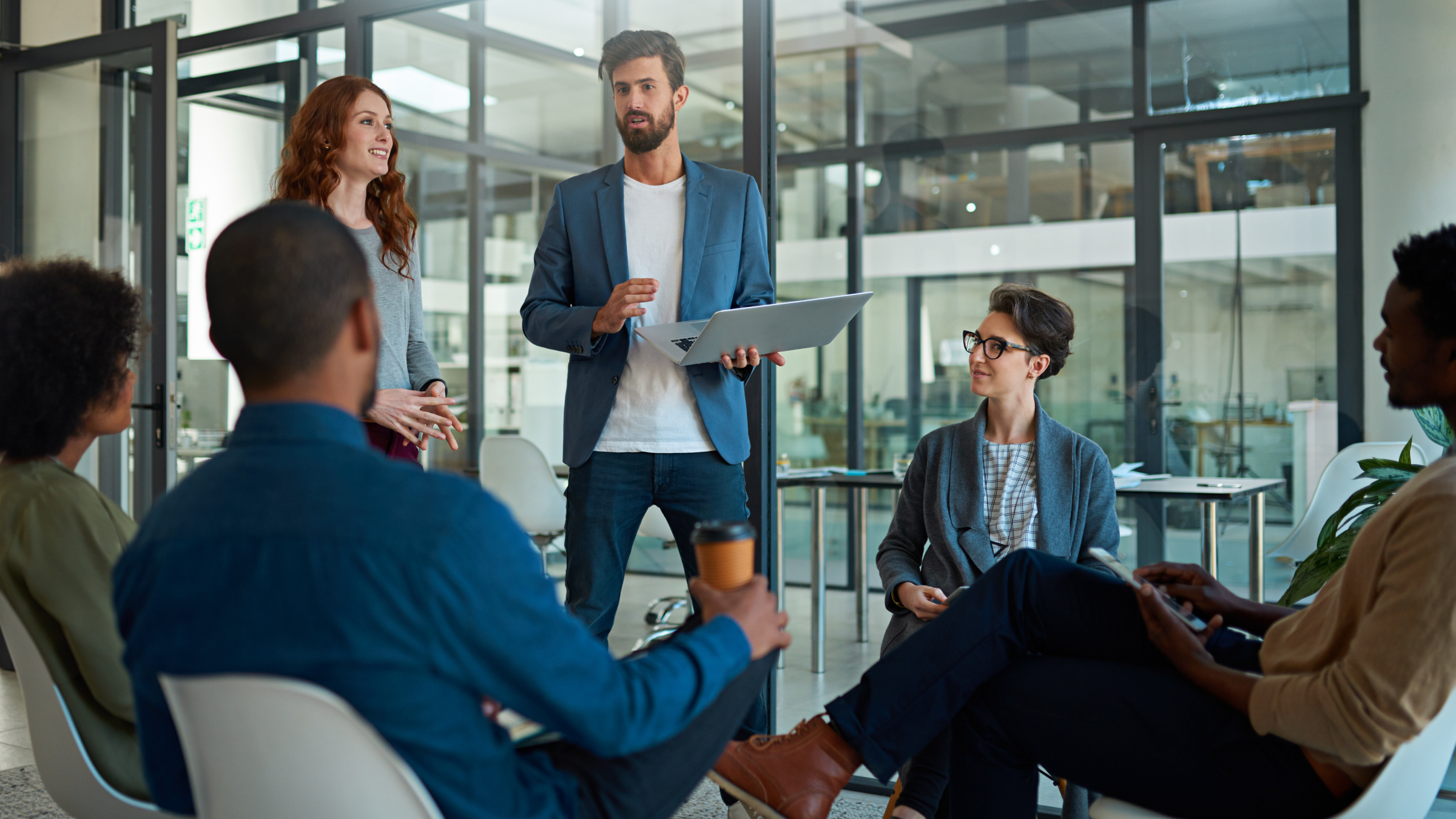 A group of employees having a meeting.