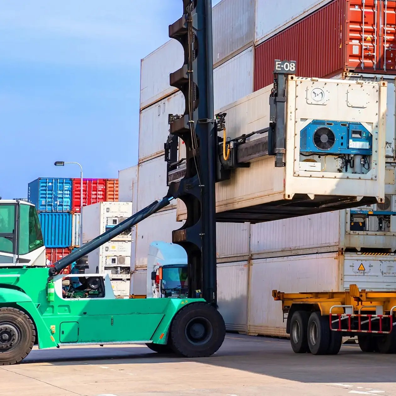 Container being loaded onto a trailer in a freight terminal