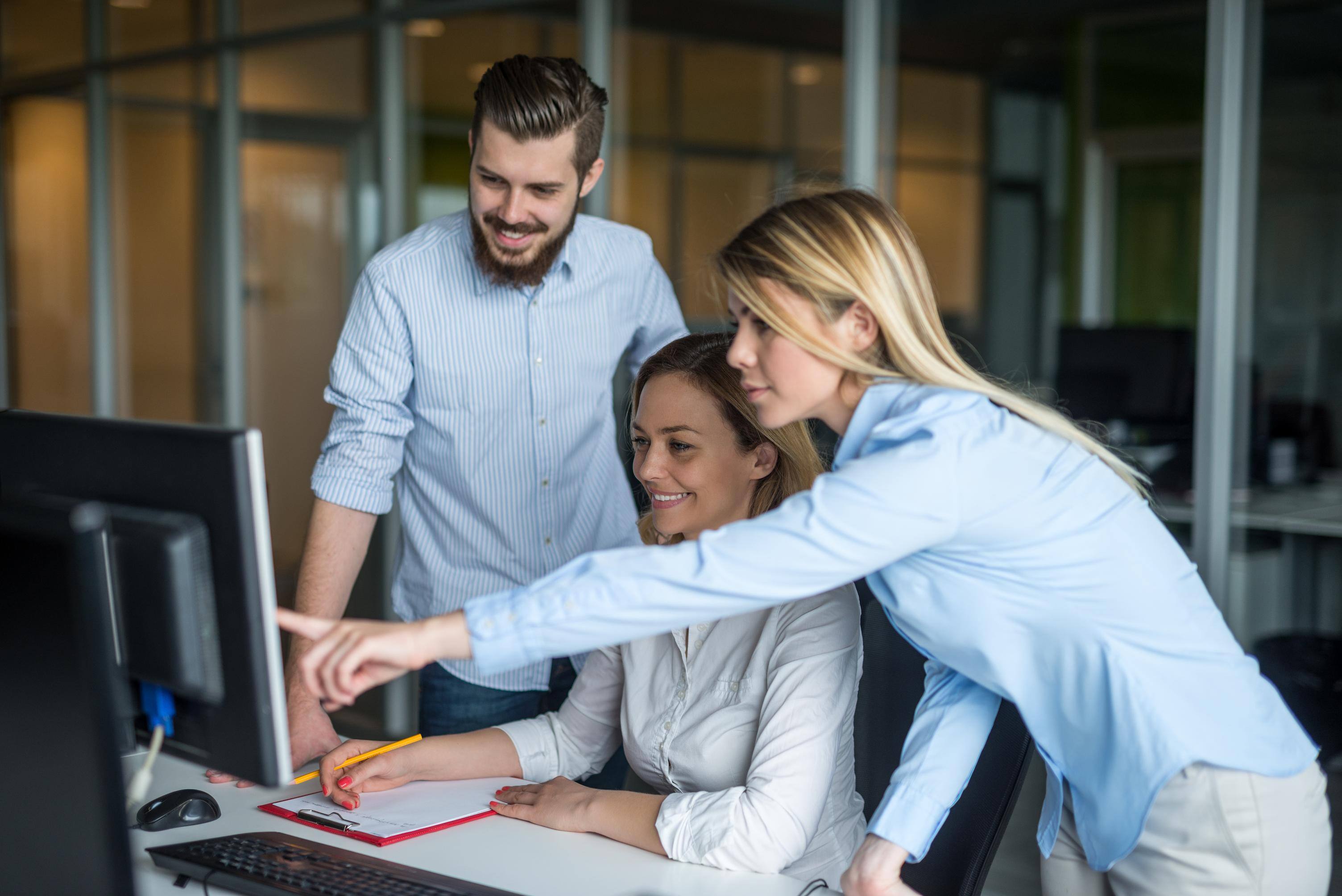 Employee helping another in IT