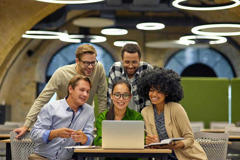 Featured image: Happy employees working together - Read full post: Managed IT Services for Small Businesses: Save, Scale, and Secure