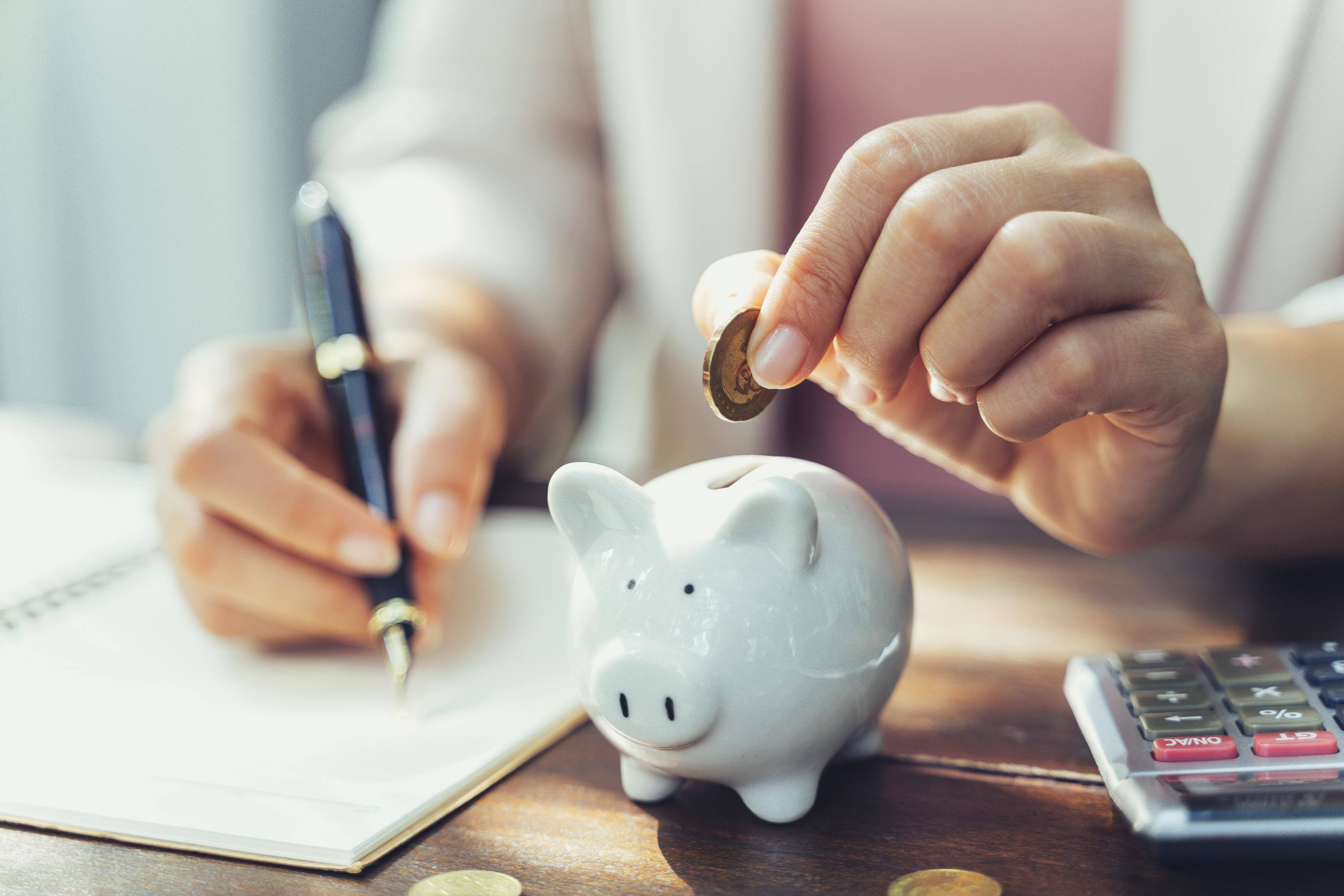 Putting a coin in a piggy bank