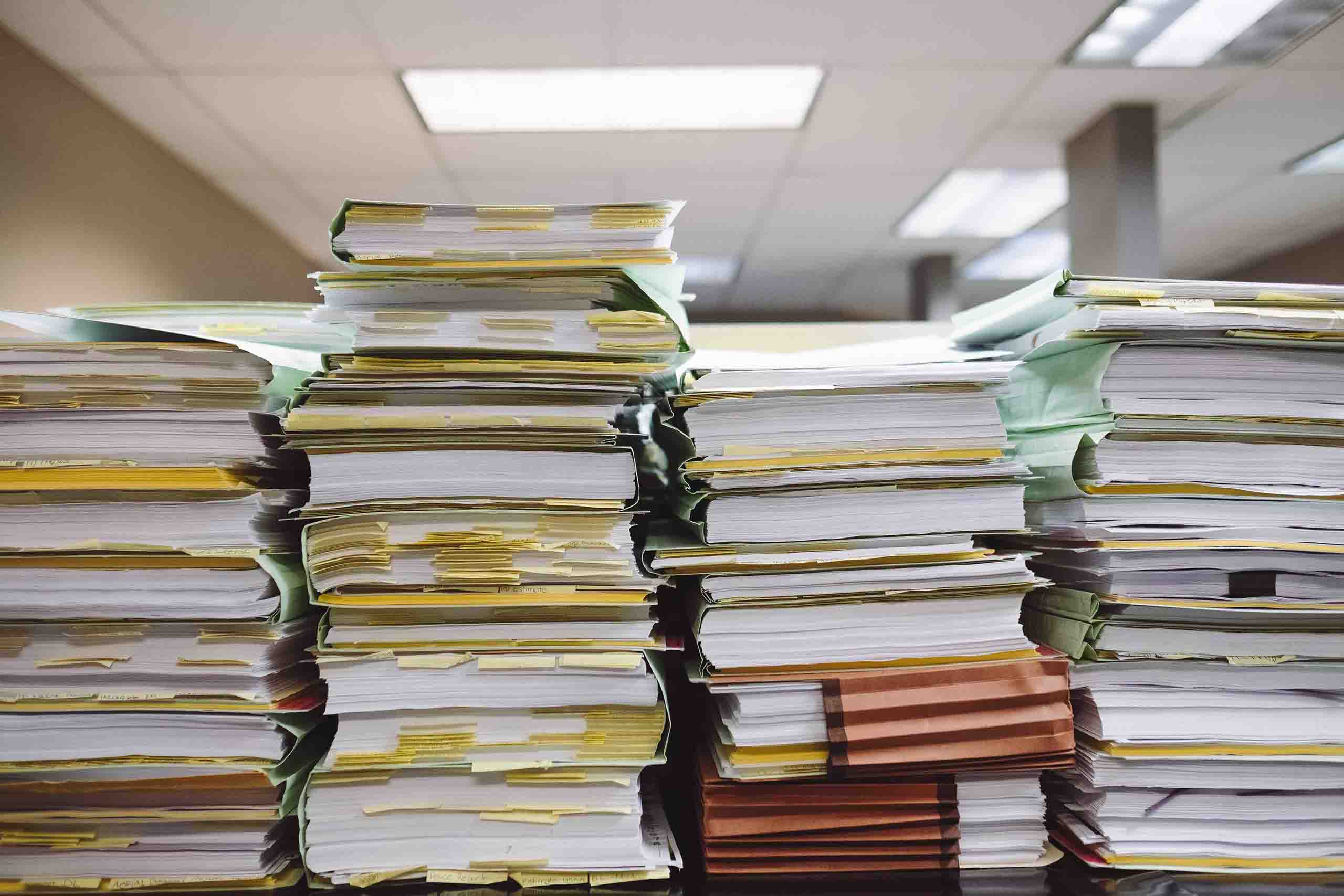 Stack of books and papers.