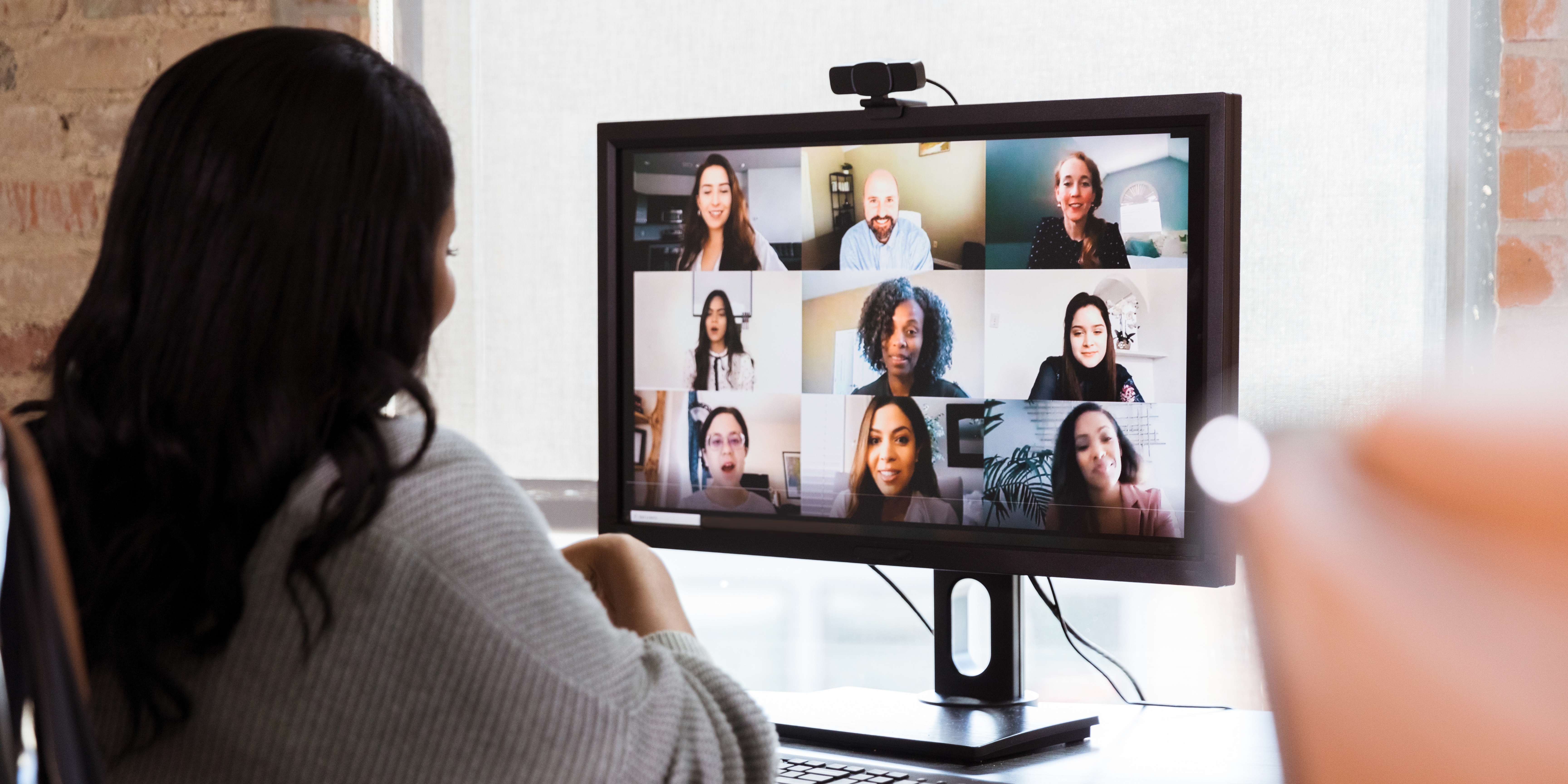 A woman participating in an online meeting.